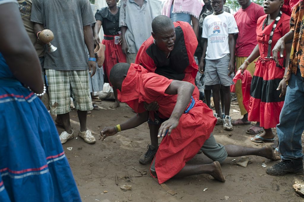 Houngan (Haitian Vodou priest) at a Vodou ceremony