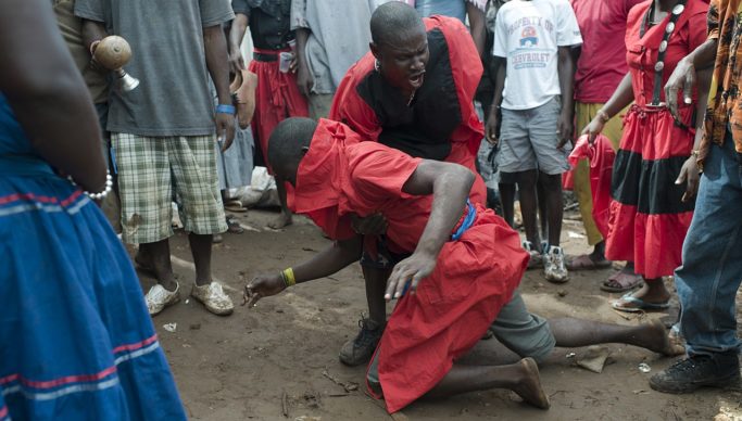 Houngan (Haitian Vodou priest) at a Vodou ceremony